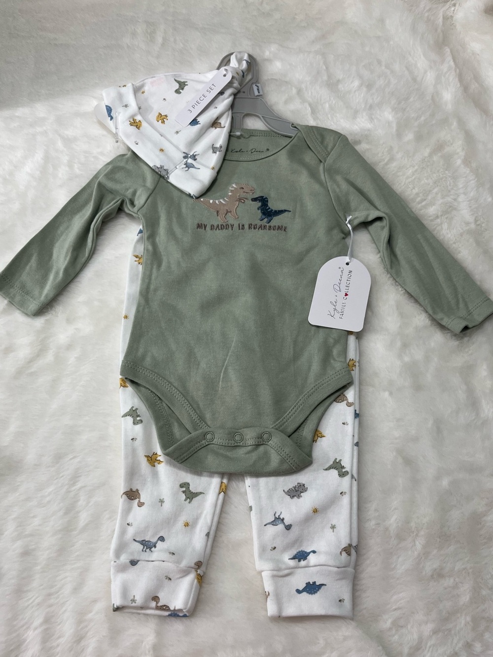 Three-Piece Sage Green Dino Baby Bodysuit Set with Printed Pants and Hat